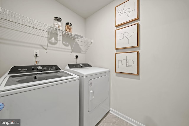 laundry area with separate washer and dryer