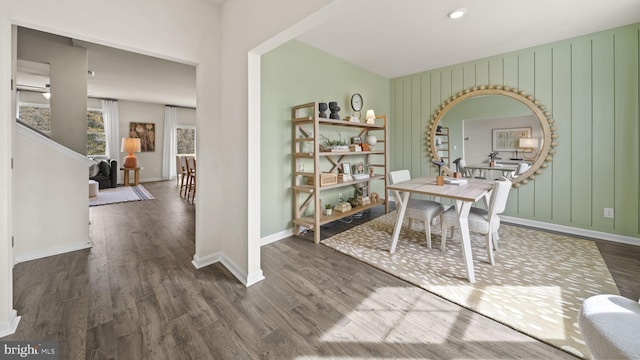 dining space featuring dark wood-type flooring