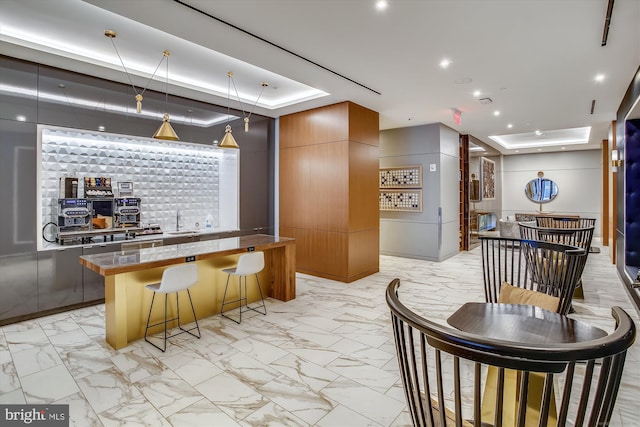 welcome area featuring indoor wet bar