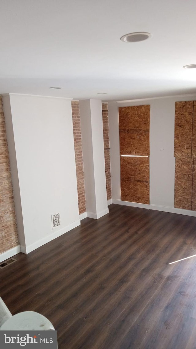 empty room featuring dark hardwood / wood-style floors