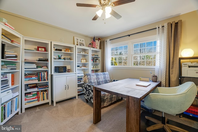 carpeted office with ceiling fan