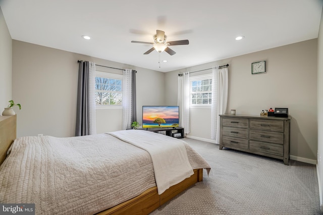 bedroom with light carpet and ceiling fan