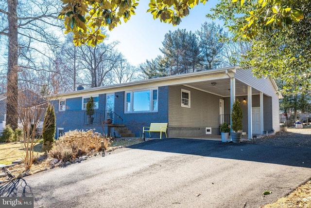 ranch-style house with a carport