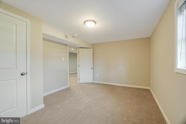 view of carpeted spare room