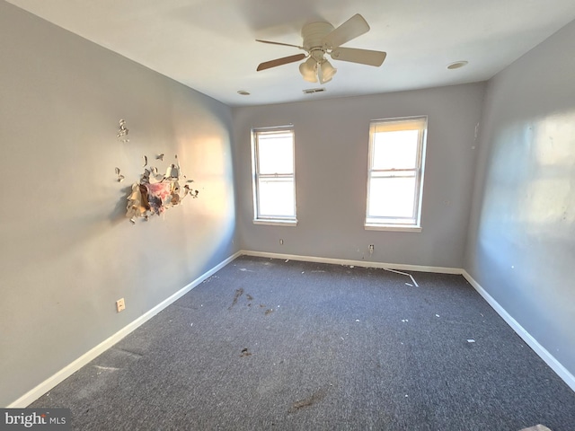 carpeted empty room with ceiling fan