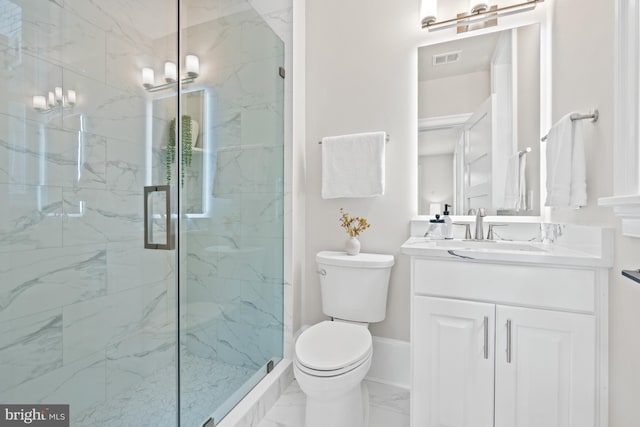 bathroom with vanity, toilet, and walk in shower