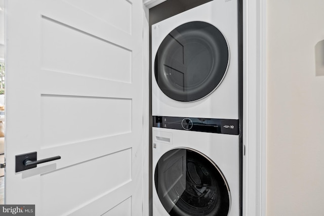 laundry room with stacked washer and clothes dryer