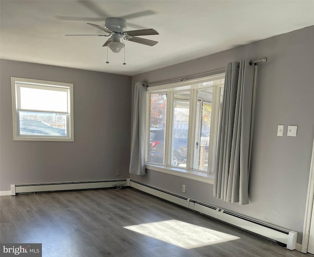 empty room featuring a baseboard radiator, dark hardwood / wood-style floors, and ceiling fan