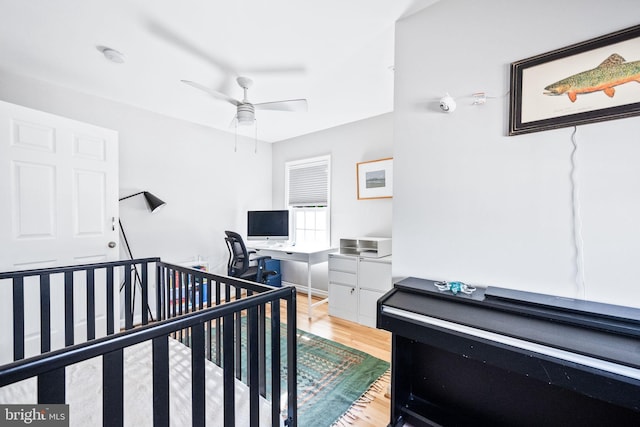 bedroom featuring light wood-style flooring and ceiling fan