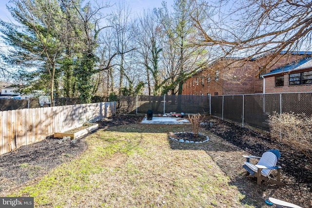 view of yard featuring a fenced backyard