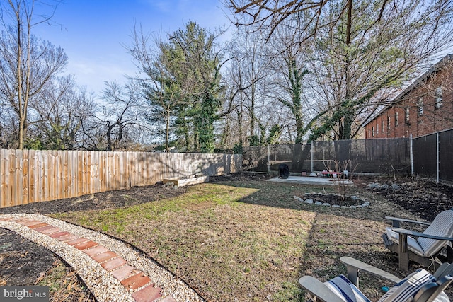 view of yard with a fenced backyard