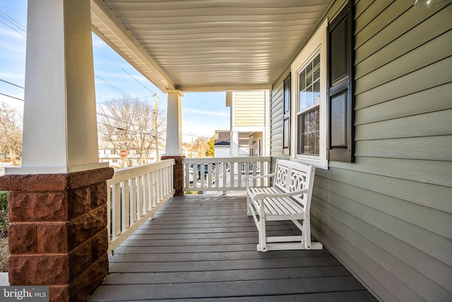 wooden deck featuring covered porch