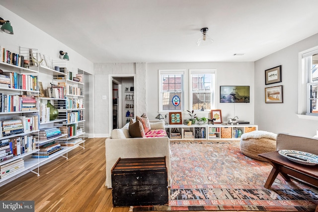 living area featuring plenty of natural light and wood finished floors