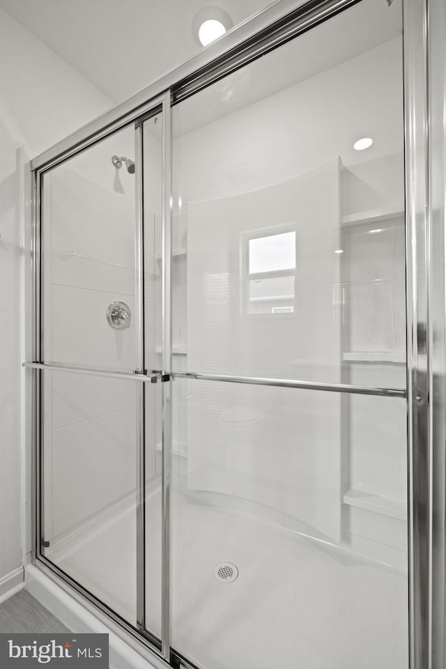 bathroom featuring an enclosed shower