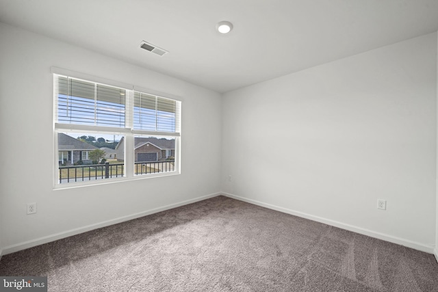 spare room featuring carpet flooring