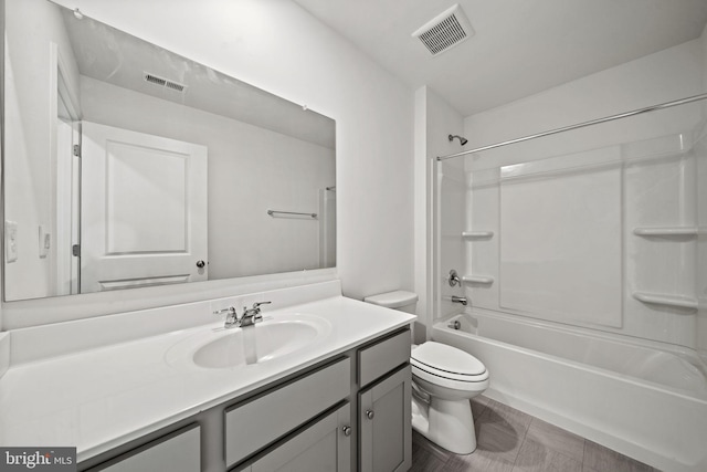 full bathroom featuring vanity, bathtub / shower combination, and toilet