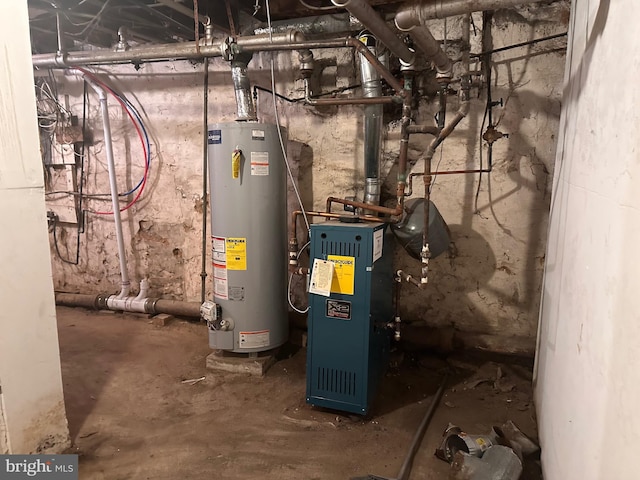 utility room with water heater and a heating unit