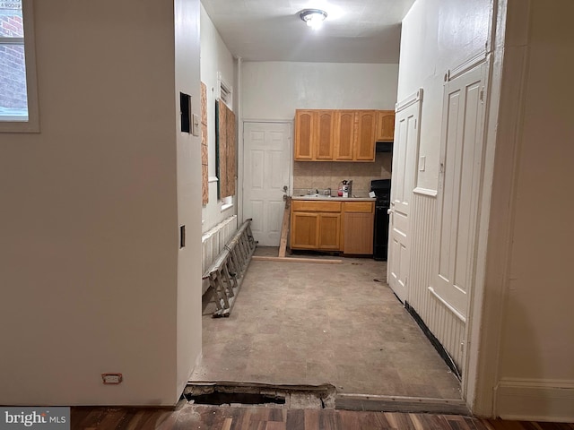 kitchen featuring light countertops and decorative backsplash