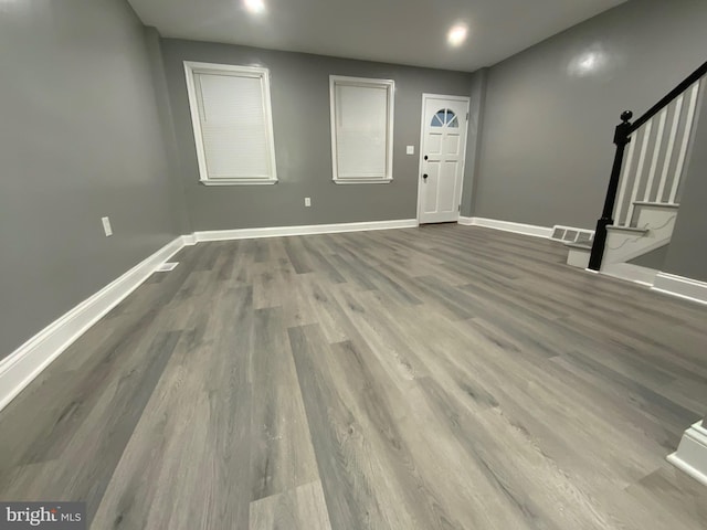 entryway with hardwood / wood-style flooring