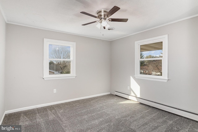 unfurnished room with ceiling fan, baseboard heating, carpet flooring, ornamental molding, and a textured ceiling