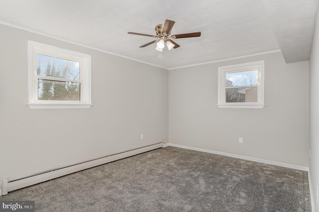 empty room featuring a baseboard heating unit, crown molding, carpet floors, and ceiling fan