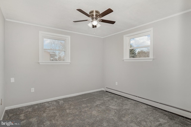 carpeted empty room with crown molding, ceiling fan, and a baseboard heating unit