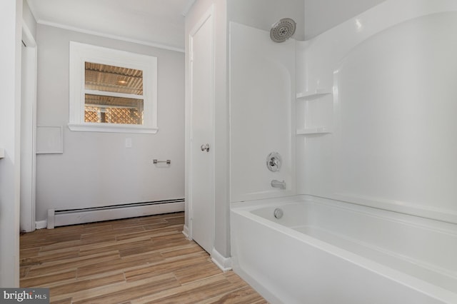 bathroom featuring shower / bathtub combination, ornamental molding, hardwood / wood-style floors, and a baseboard heating unit