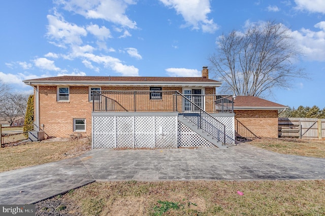 rear view of property featuring central air condition unit