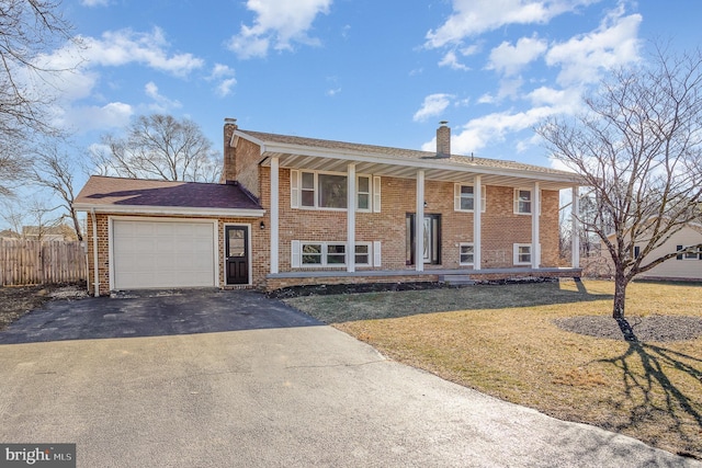 raised ranch featuring a garage