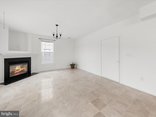 unfurnished living room with an inviting chandelier and a fireplace with flush hearth