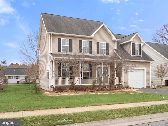 view of front of property with roof with shingles, a porch, an attached garage, a front yard, and driveway