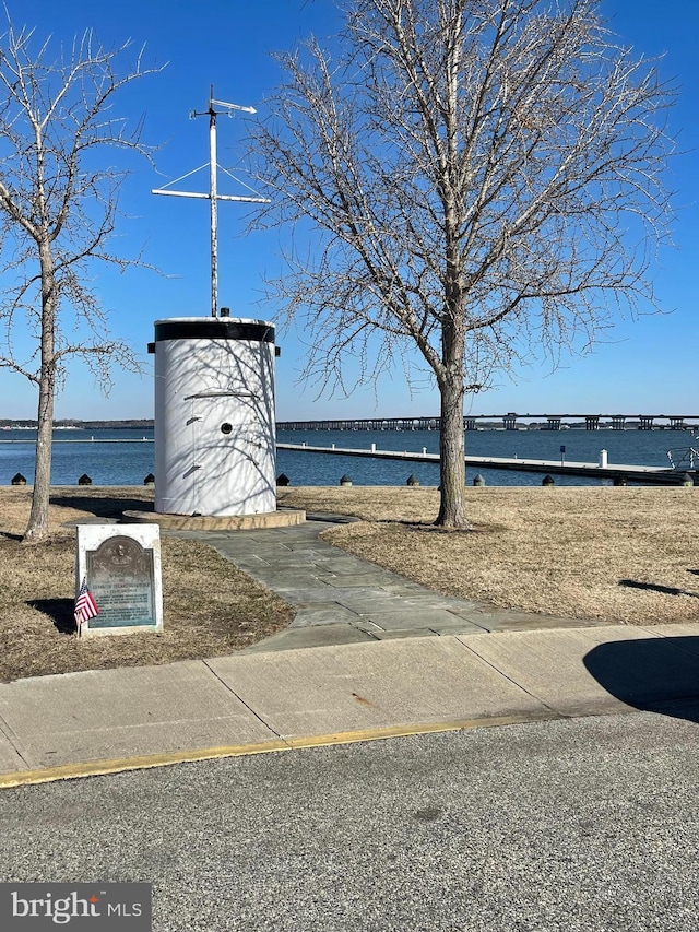 surrounding community with a water view