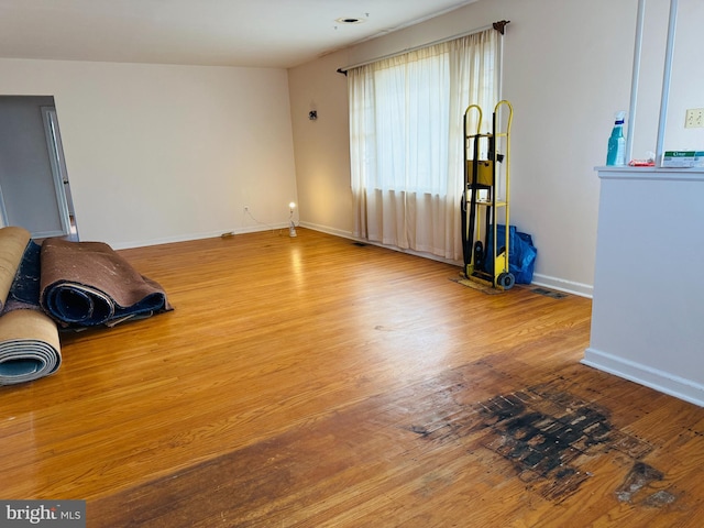 unfurnished room featuring hardwood / wood-style floors