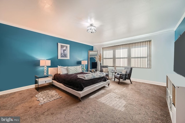 carpeted bedroom featuring baseboards and ornamental molding