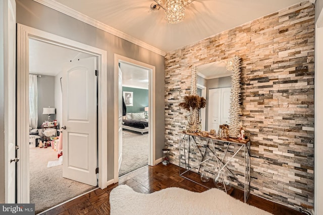 hallway with baseboards and crown molding