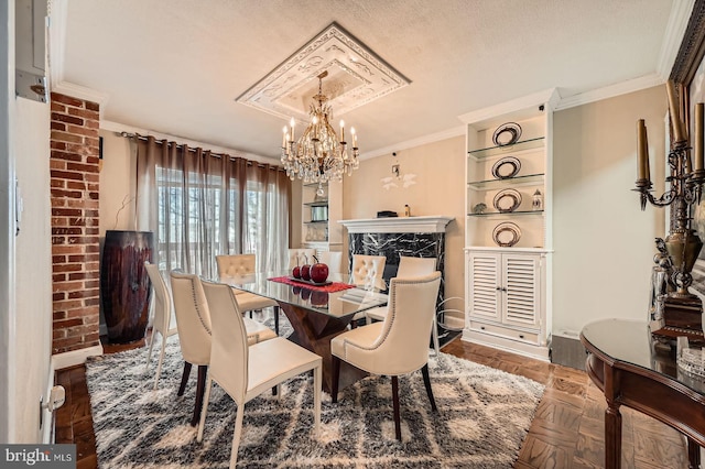 dining area featuring baseboards, a chandelier, and crown molding