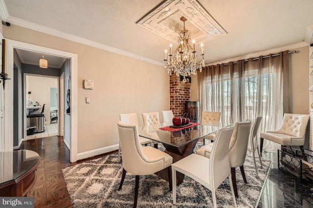 dining area with baseboards, a notable chandelier, crown molding, and a textured ceiling