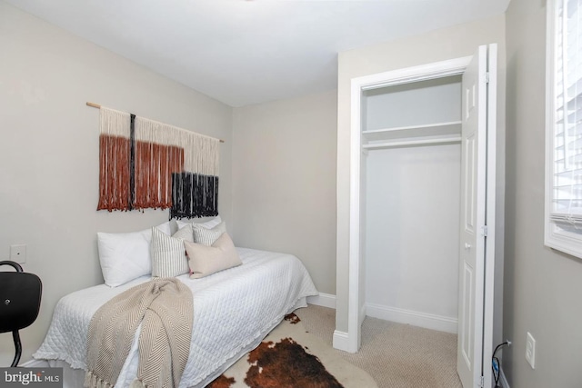 carpeted bedroom featuring a closet