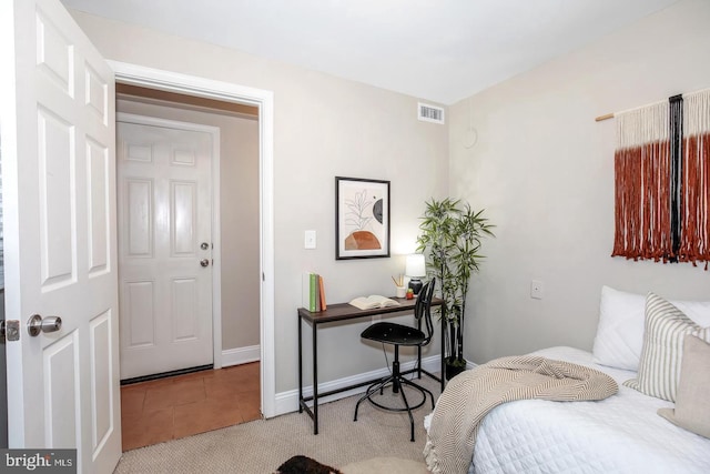 bedroom with light carpet