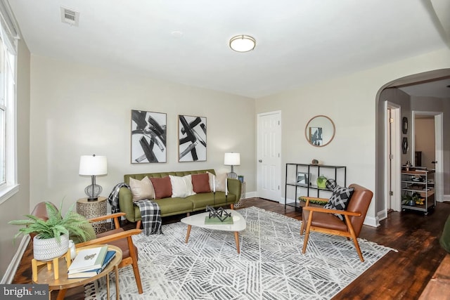 living room featuring dark hardwood / wood-style flooring