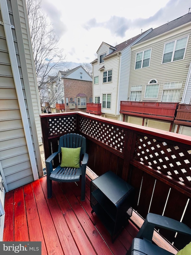 wooden terrace featuring a residential view