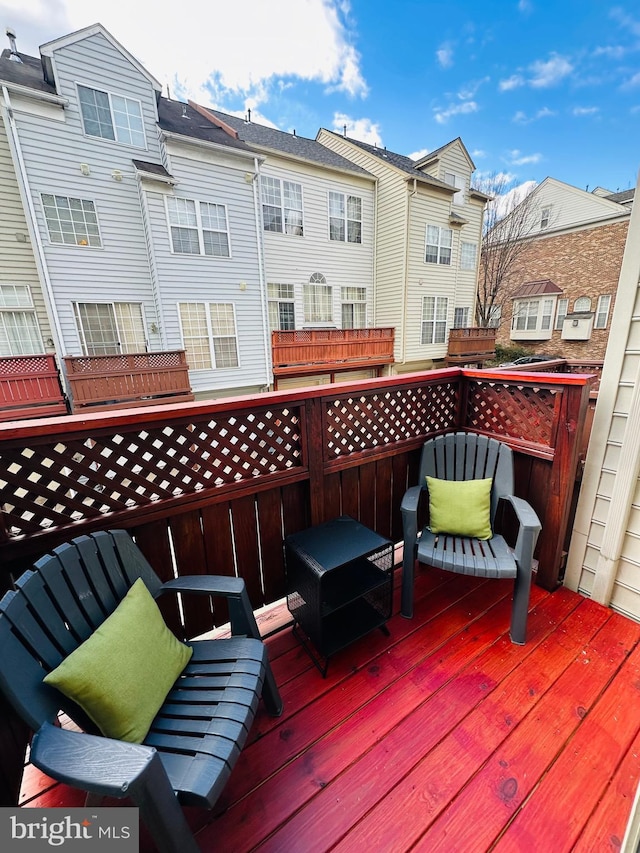 wooden terrace with a residential view