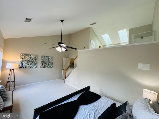 bedroom featuring carpet, a skylight, visible vents, and baseboards