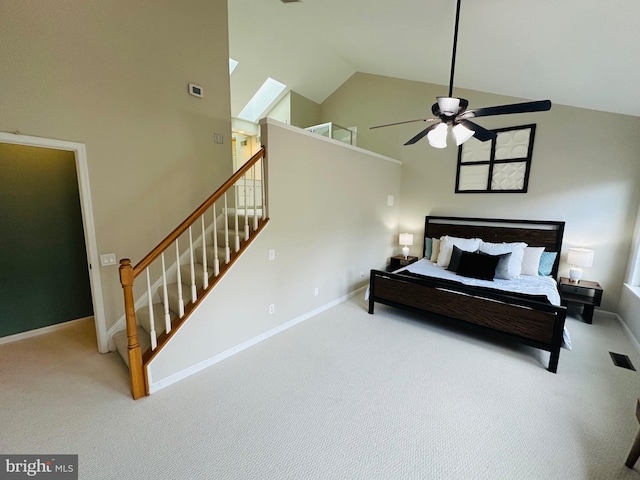 carpeted bedroom featuring ceiling fan, high vaulted ceiling, visible vents, and baseboards