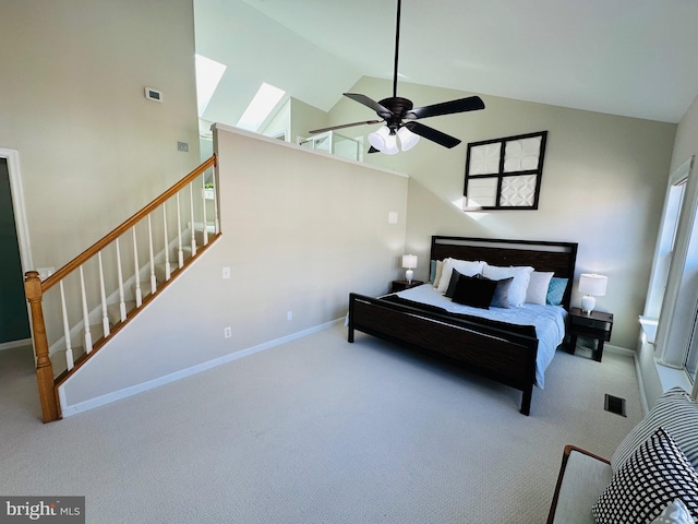 bedroom featuring carpet floors, high vaulted ceiling, ceiling fan, and baseboards