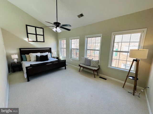 carpeted bedroom featuring high vaulted ceiling, a ceiling fan, visible vents, and baseboards