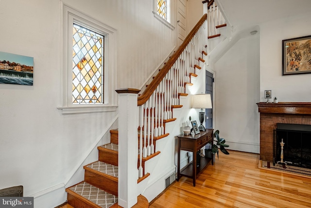 stairs featuring hardwood / wood-style floors