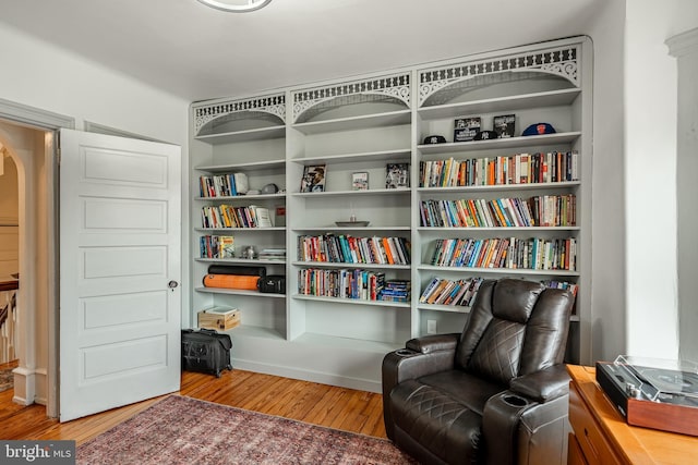 living area with hardwood / wood-style floors