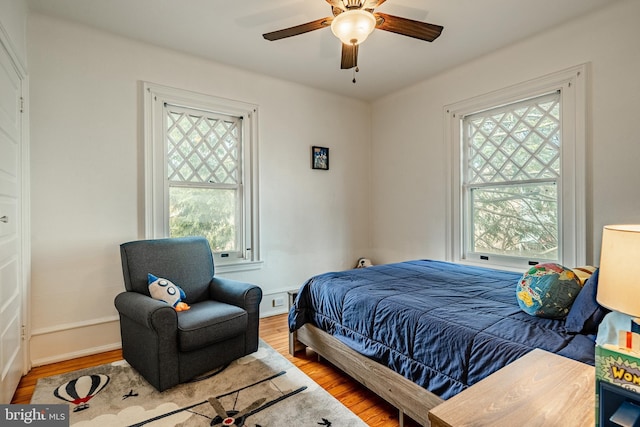 bedroom featuring ceiling fan and hardwood / wood-style floors