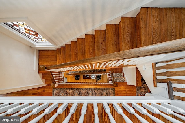 stairway featuring lofted ceiling